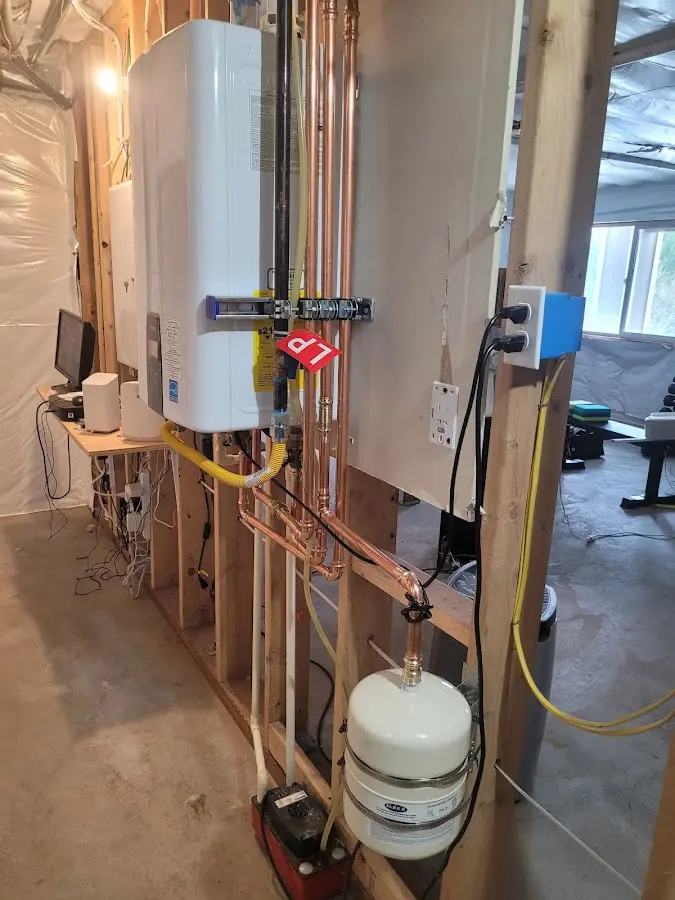Licensed plumber repairing a kitchen sink in Larned